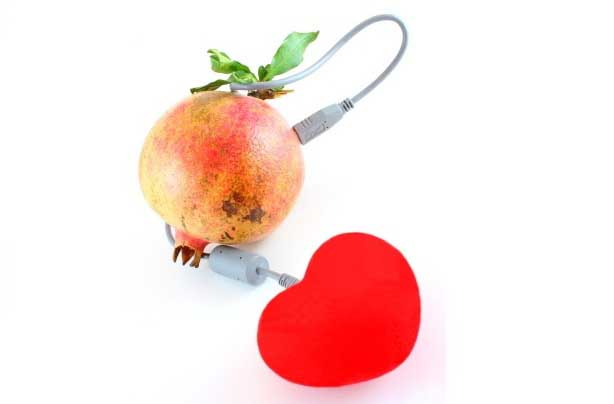 pomegranate plugged in a heart shape